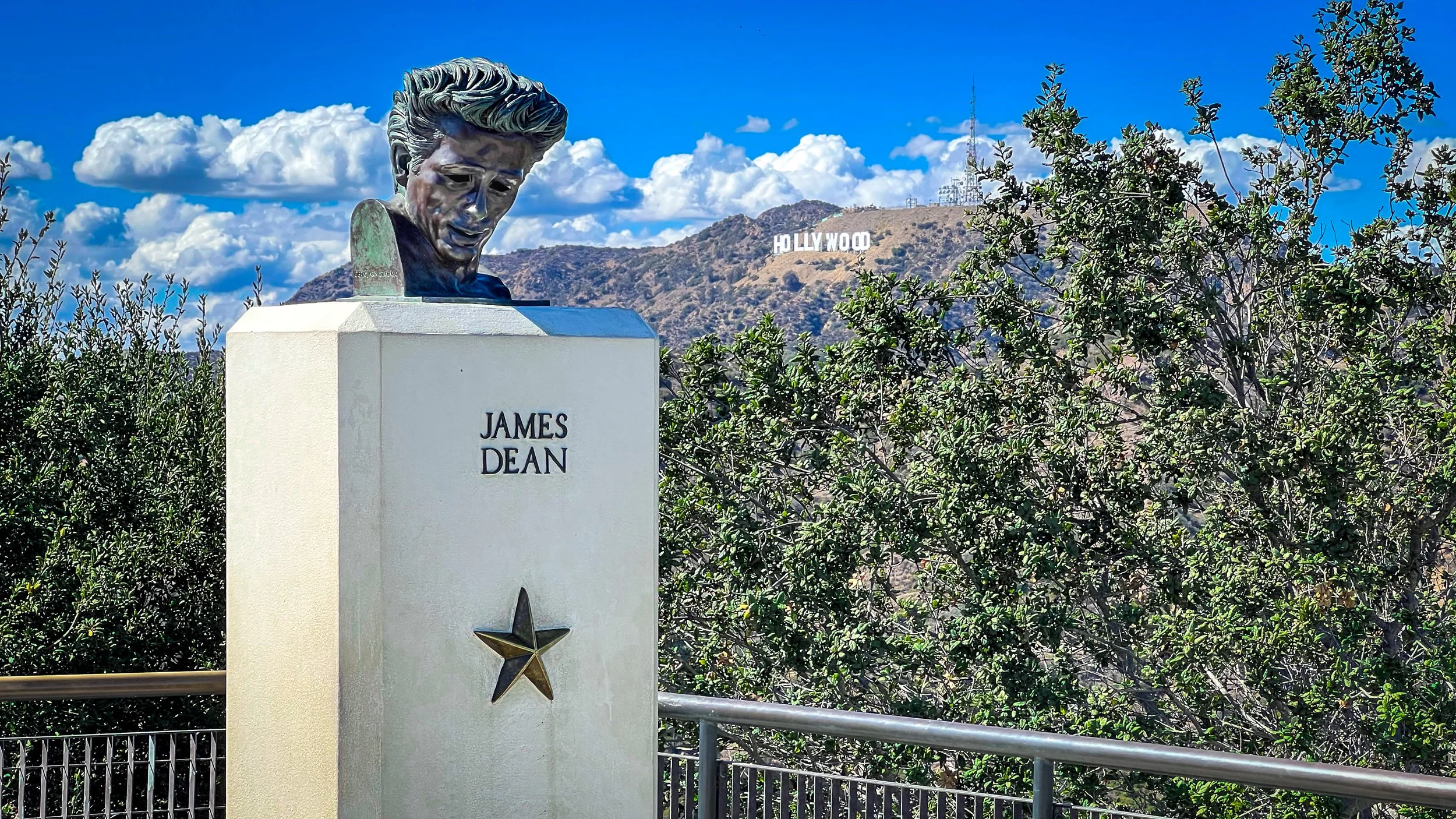 James Dean bust at Griffith Observatory with the Hollywood sign behind